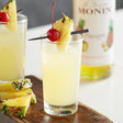 Monin Premium Pineapple Flavoring / Fruit Syrup 750 mL - 12/Case