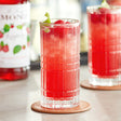 Monin Premium Raspberry Flavoring / Fruit Syrup - 750 mL - 12/Case
