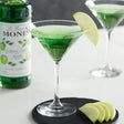 Monin Premium Granny Smith Apple Flavoring / Fruit Syrup 750 mL - 12/Case