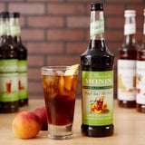 Monin 750 mL Peach Tea 7:1 Concentrate - 12/Case