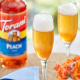 Torani Peach Flavoring / Fruit Syrup 750 mL Glass Bottle - 12/Case