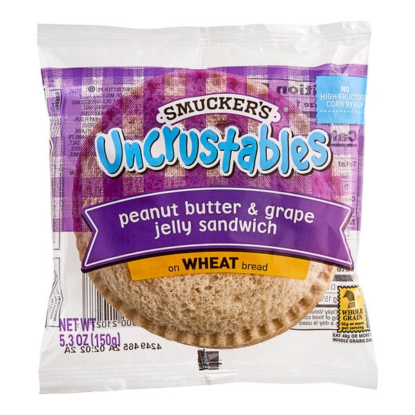 Smucker's Uncrustables Grape Jelly and Peanut Butter Whole Wheat Sandwich 5.3 oz. - 72/Case