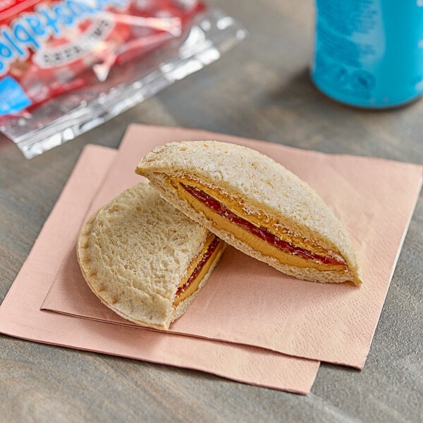 Smucker's Uncrustables Strawberry Jam and Peanut Butter Whole Wheat Sandwich 2.6 oz. - 72/Case