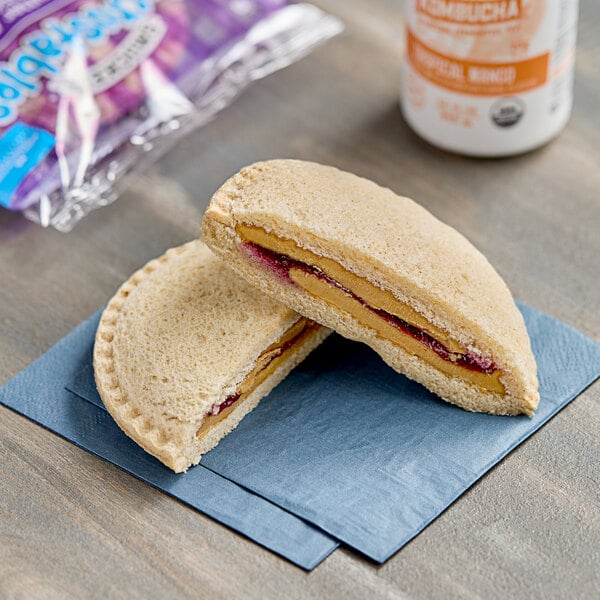 Smucker's Uncrustables Grape Jelly and Peanut Butter Whole Wheat Sandwich 5.3 oz. - 72/Case