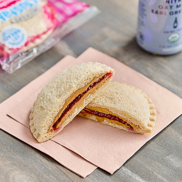 Smucker's Uncrustables Raspberry Spread and Peanut Butter Whole Wheat Sandwich 2.6 oz. - 72/Case
