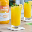 Monin Brilliance Starfruit Yellow Natural 5:1 Energy Concentrate 64 fl. oz. - 4/Case