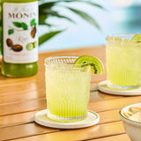 Monin Premium Kiwi Flavoring / Fruit Syrup 750 mL - 12/Case