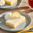 Sweet Street Desserts 2.87 oz. Pre-Cut Lemon Bar Squares 16-Count Tray - 4/Case