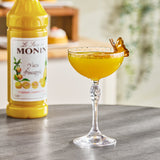 Monin Premium Yuzu Pineapple Flavoring Syrup 1 Liter - 4/Case