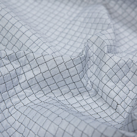 Black and White Reversible Quilted Coating with Filler