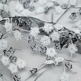 Stretch Net with Sequins - White Fancy Floral Clusters on Black