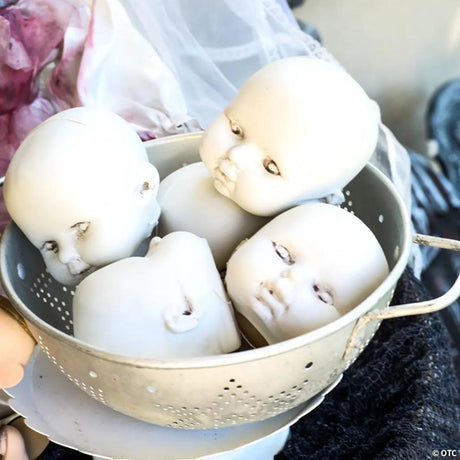 Plastic Halloween Doll Heads Set in Mesh Bag for Prop Making, featuring a haunted Halloween doll design