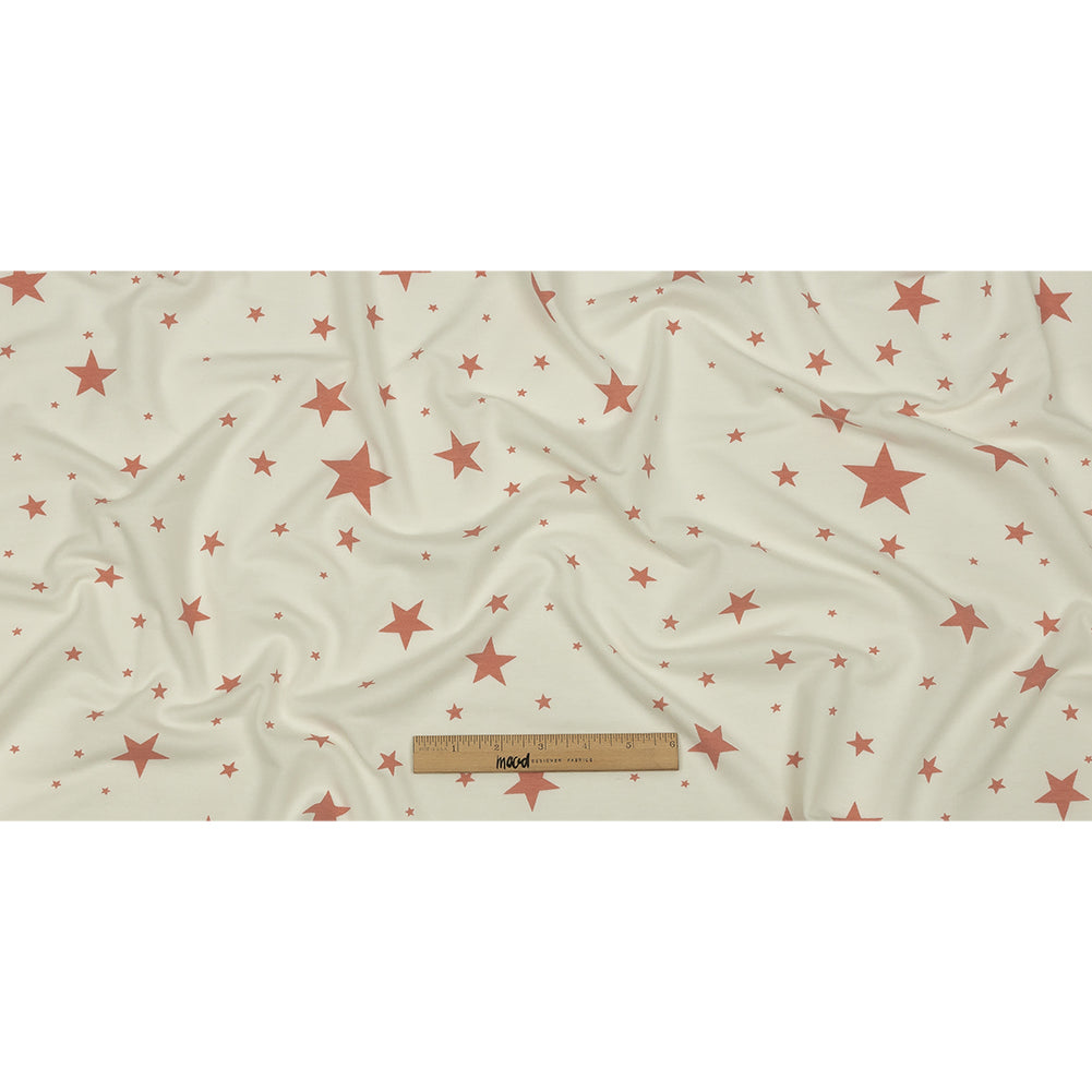 Cloud Dancer and Coral Almond Stars Stretch Polyester and Rayon French Terry