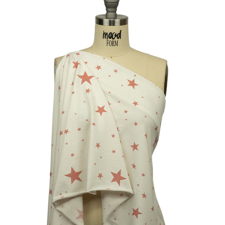 Cloud Dancer and Coral Almond Stars Stretch Polyester and Rayon French Terry