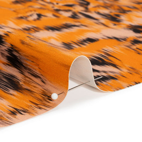 Stretch Polyester Woven Print - Orange and Black Abstract Ikat - Mood Exclusive Shifting Sands