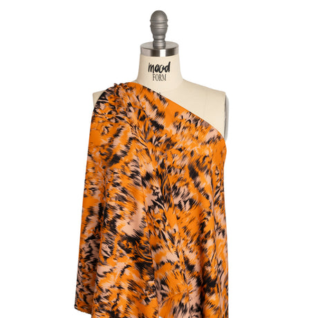 Stretch Polyester Woven Print - Orange and Black Abstract Ikat - Mood Exclusive Shifting Sands