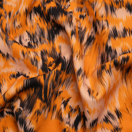 Stretch Polyester Woven Print - Orange and Black Abstract Ikat - Mood Exclusive Shifting Sands