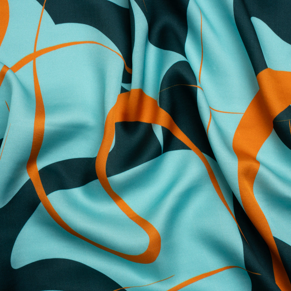 Sustainable and Recycled Viscose Satin Print - Turquoise and Orange Swirling Abstract - Mood Exclusive Atmospheric Adventure