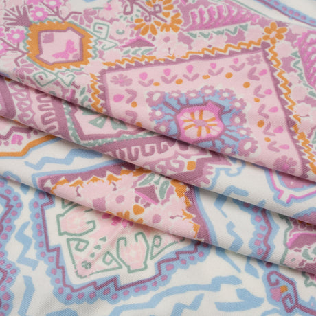 Stretch Polyester Jersey - Pale Pink, Baby Blue, and Golden Yellow Geometric Medallions