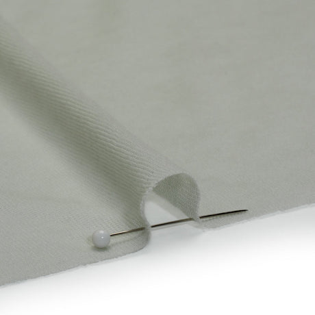 Honeydew green lightweight cotton interlock knit fabric