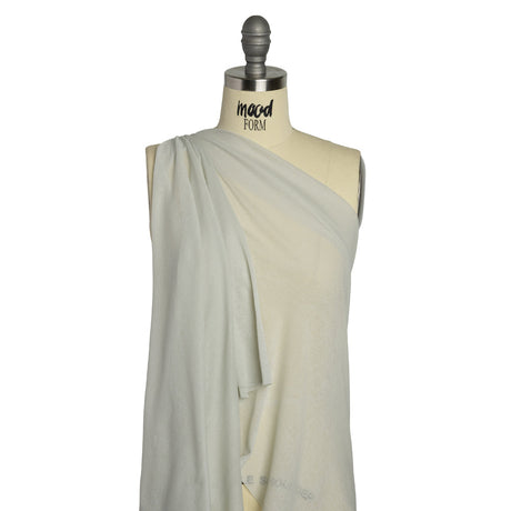 Honeydew green lightweight cotton interlock knit fabric