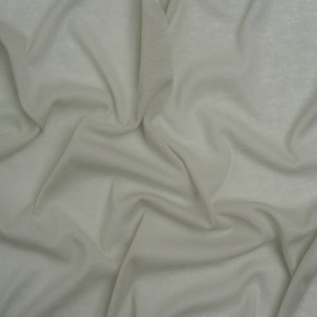 Honeydew green lightweight cotton interlock knit fabric