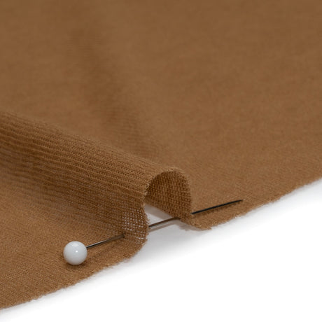 Tan cotton interlock knit fabric for soft apparel sewing