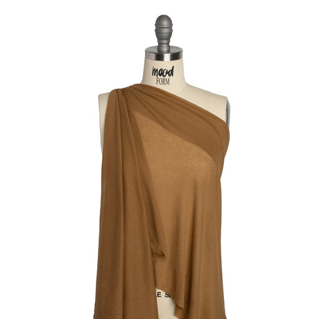 Tan cotton interlock knit fabric for soft apparel sewing
