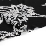 Stretch Polyester Tricot - Black and White Chain Stitch Flowers - Designer Deadstock