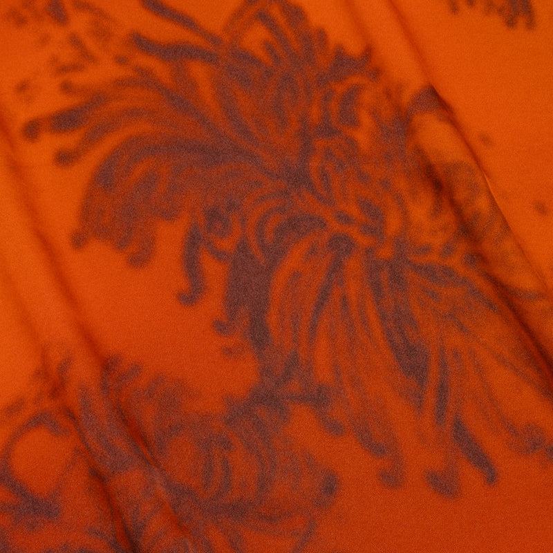 Orange and black floral satin-faced rayon twill fabric for sewing