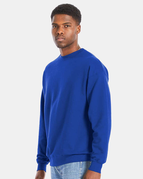 Model wearing Hanes Perfect Fleece Long Sleeve Crewneck Sweatshirt