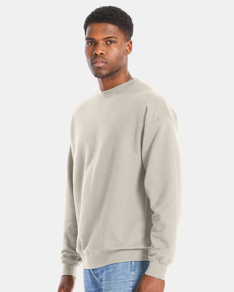 Model wearing Hanes Perfect Fleece Long Sleeve Crewneck Sweatshirt