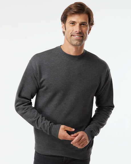 Model wearing Hanes Perfect Fleece Long Sleeve Crewneck Sweatshirt