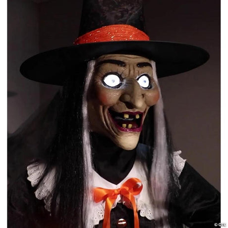 Animated Witch Halloween Decoration with Moving Head and LED Lights, lights up for a spooky Halloween night display