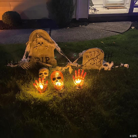 8.5-Inch Lighted Orange Skull and Hands Halloween Decoration on 4ft Black Wire