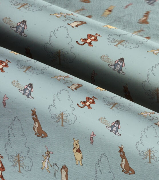 Quilting Cotton Disney Winnie the Pooh Group on Blue