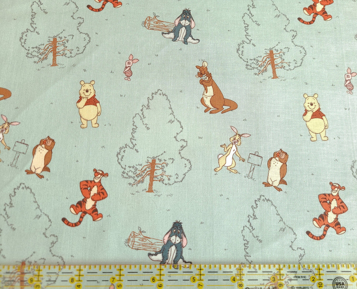 Quilting Cotton Disney Winnie the Pooh Group on Blue