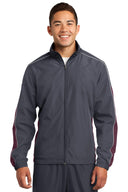 Chaqueta cortavientos colorblock con ribete Sport-Tek®.