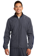 Chaqueta cortavientos colorblock con ribete Sport-Tek®.