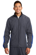 Chaqueta cortavientos colorblock con ribete Sport-Tek®.