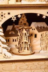 14.75 inch Lighted Laser Cut Wood Village Scene with Moving Figurine and Candles