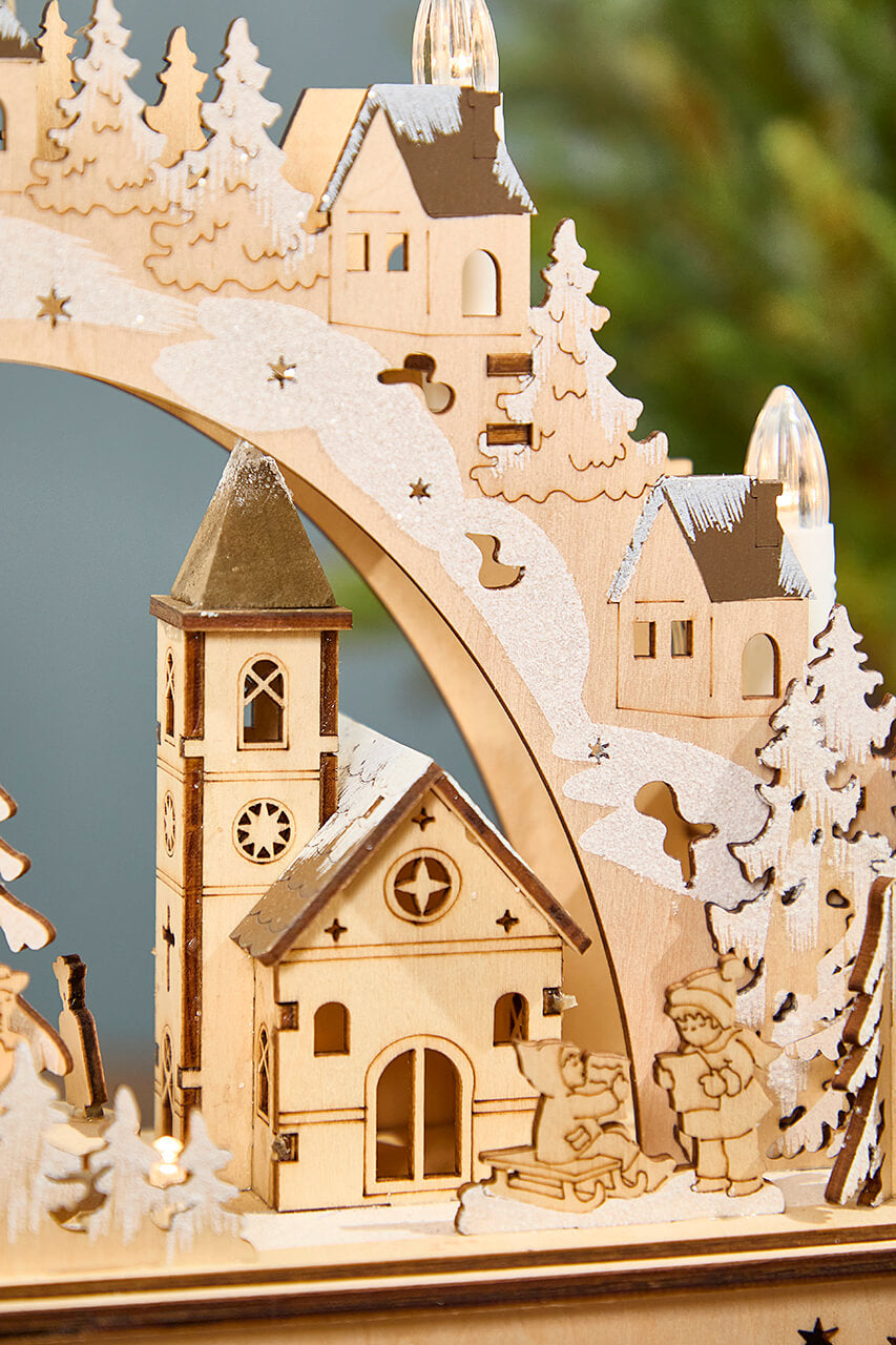 14.75" Lighted Laser Cut Wood Village Scene with Moving Figurine and Candles
