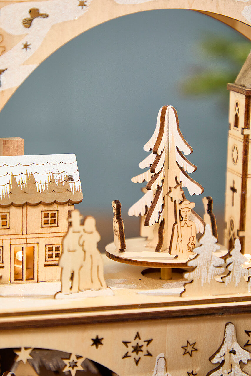 14.75" Lighted Laser Cut Wood Village Scene with Moving Figurine and Candles