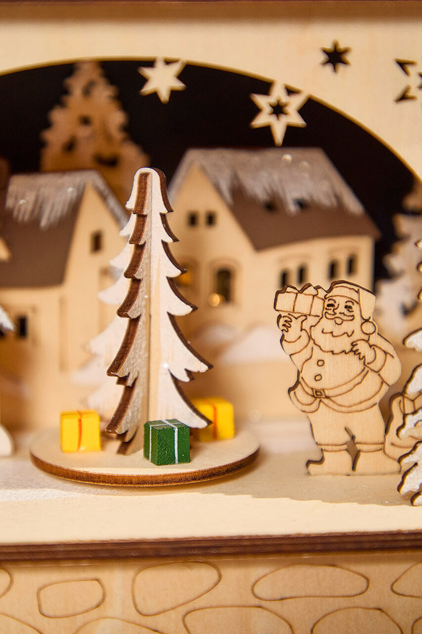 14.75" Lighted Laser Cut Wood Village Scene with Moving Figurine and Candles