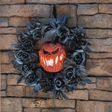 17 1/4" Black Floral Wreath with Light-Up Pumpkin Halloween Decoration
