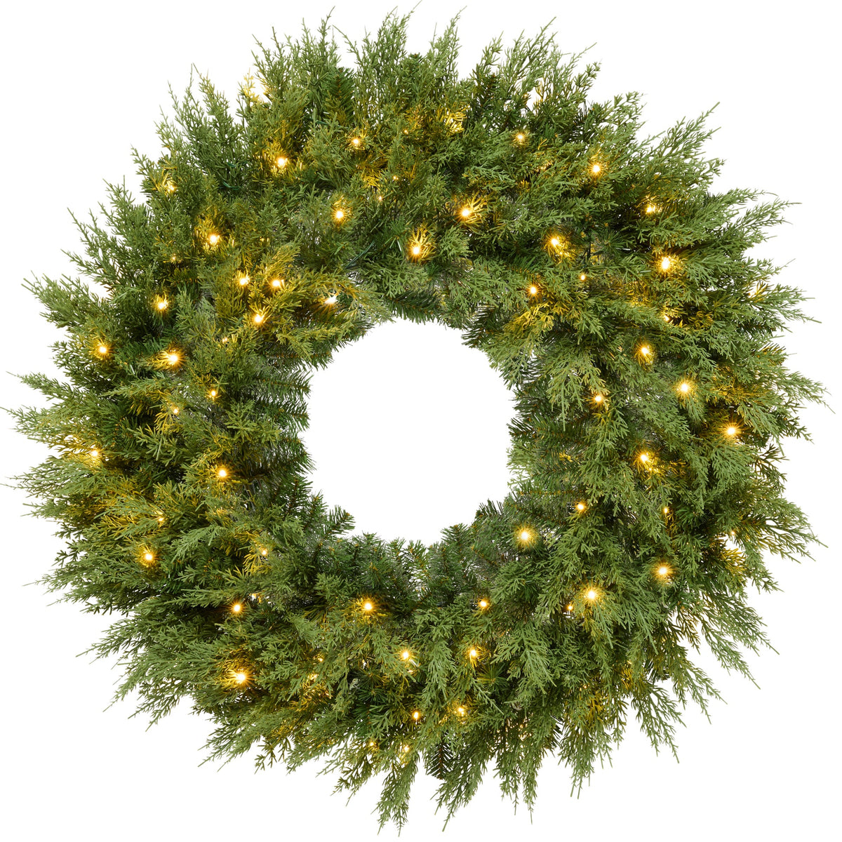 Pre-lit cedar cypress Christmas wreath glowing with twinkling LED lights on front door
