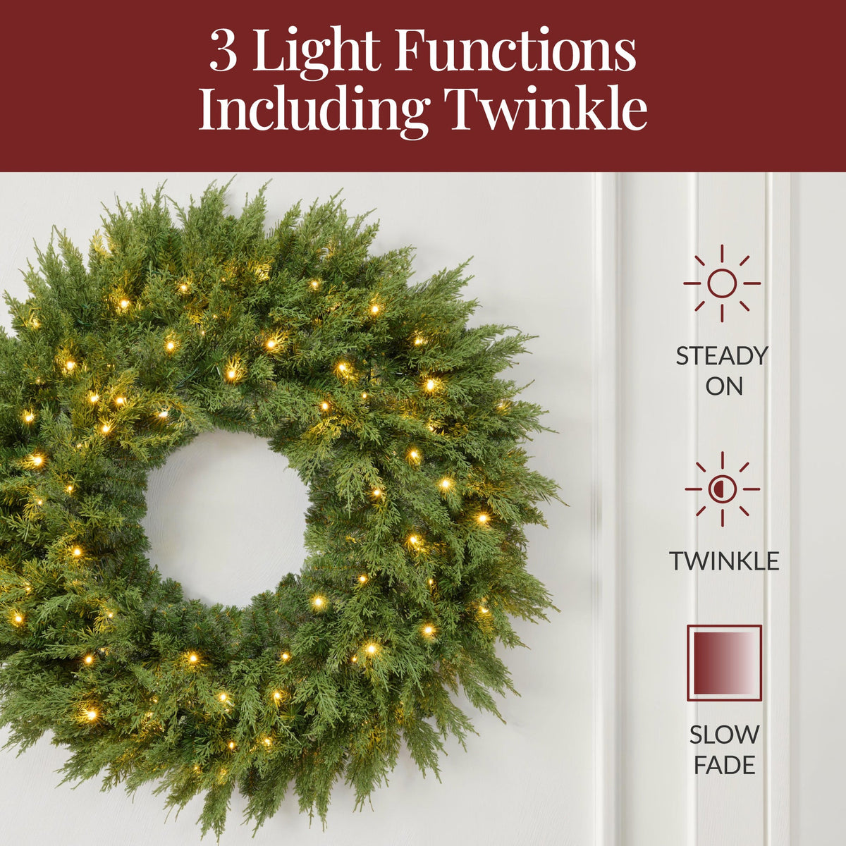 Pre-lit cedar cypress Christmas wreath glowing with twinkling LED lights on front door