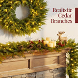 Pre-lit cedar cypress Christmas garland with twinkling LED lights draped over a mantel