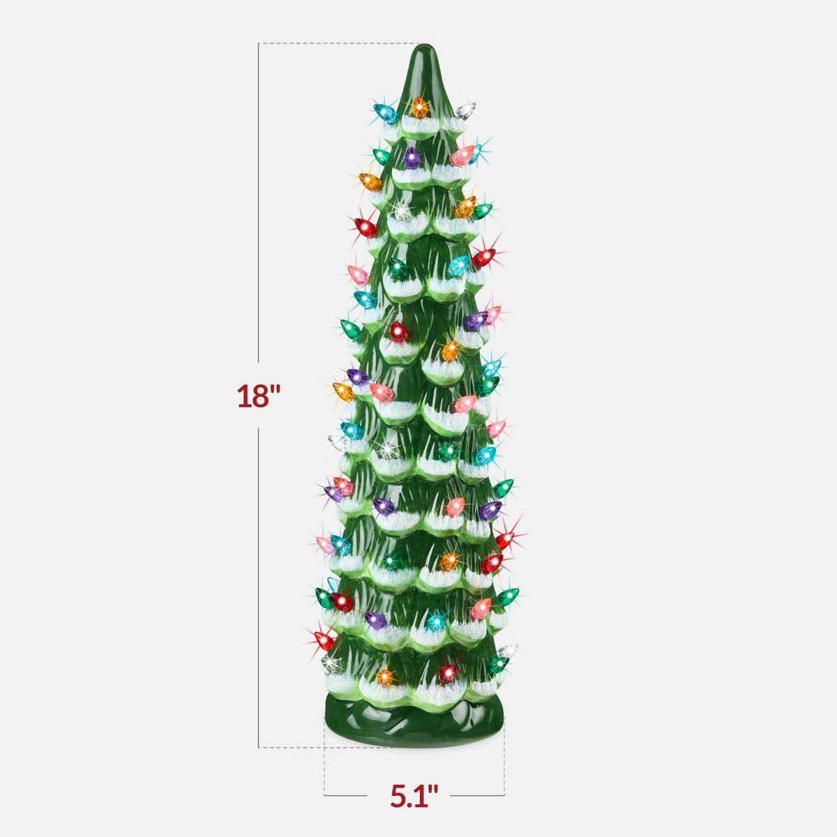 Hand-painted ceramic Christmas tree with glowing LED lights displayed as mantel decor