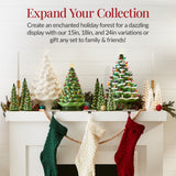 Hand-painted ceramic Christmas tree with glowing LED lights displayed as mantel decor